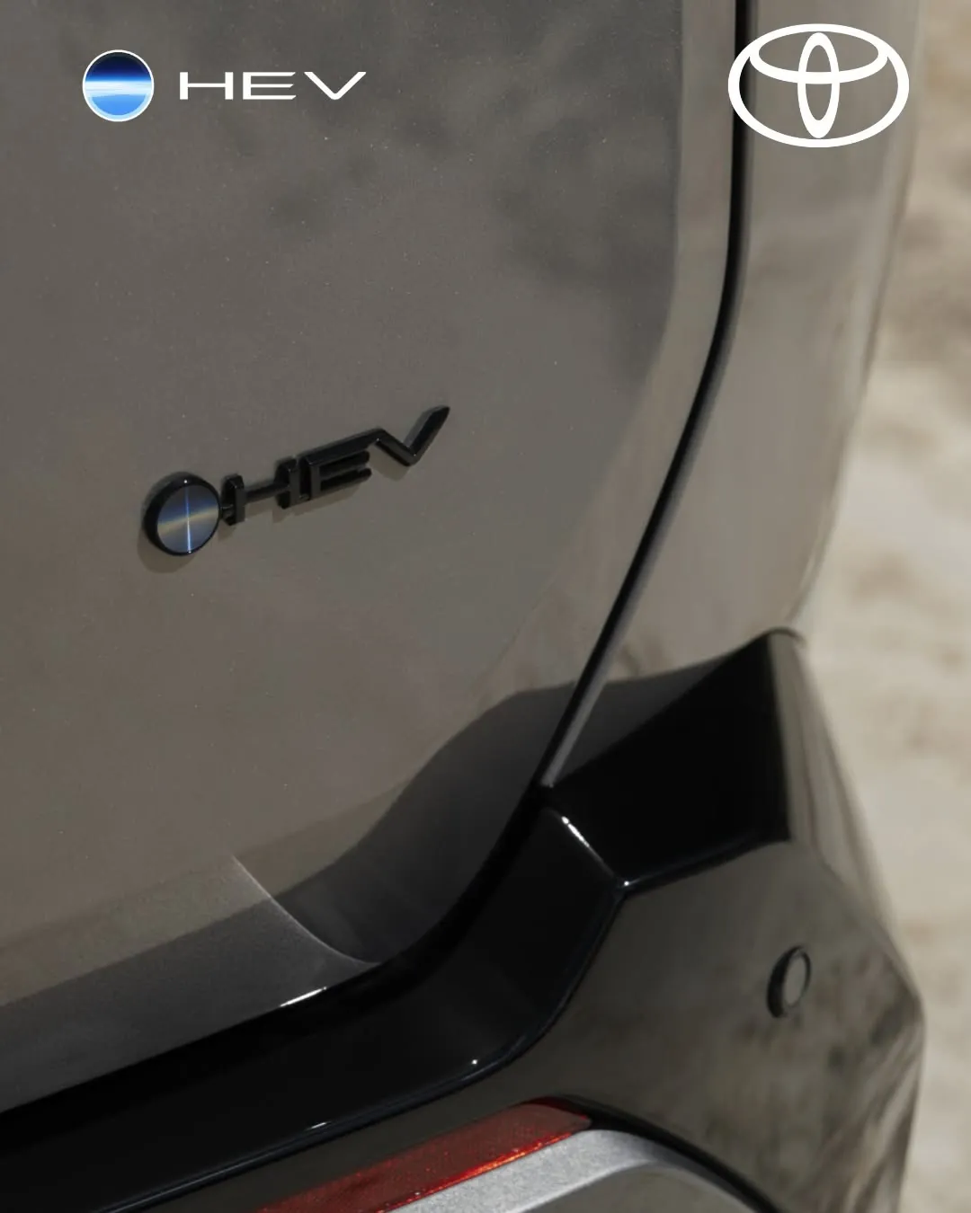 A hybrid badge on a Toyota