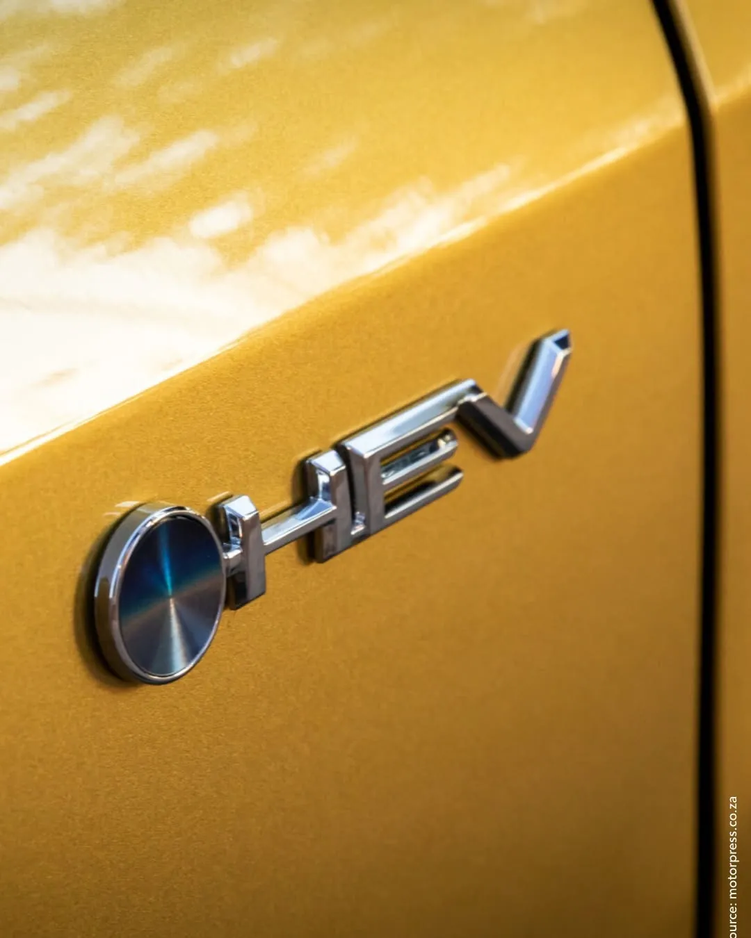 Detail of a Toyota badge and paint finish
